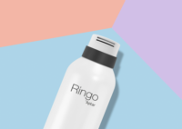 A white bottle labeled Ringo by Aptar, which is a twist-to-lock aerosol actuator for foam , with a black collar lies on a pastel background divided into blue, lilac, pink, and peach sections.
