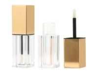 Two clear square lip gloss tubes with gold caps showcase elegant lipgloss packaging—one closed, one open with the applicator wand uncapped to reveal the bottle opening from a custom cosmetic packaging manufacturer.