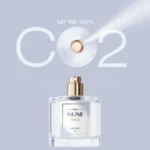Aptar Beauty's INUNE fragrance pump is showcased with the graphic reading, 'CO2,' highlighting that INUNE can be made with Post-Consumer Recycled Aluminum and Low Carbon Aluminum