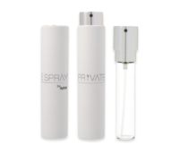 Three refillable fragrance purse spray bottles are shown: two with white outer cases and silver caps, and one clear glass bottle with a silver spray top, revealing the inner mechanism. All bottles stand upright.