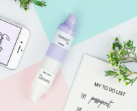 Aptar’s Twinset 2-in-1 airless packaging displayed on a white background, featuring a sleek dual-chamber bottle labeled 'Primer' and 'Face Care', designed for on-the-go beauty routines.