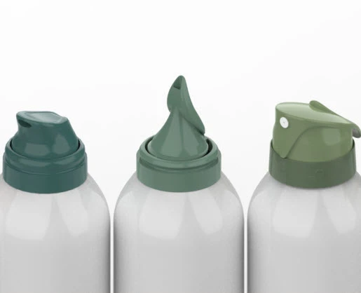 Three white bottles with different green dispenser tops are lined up side by side against a plain background.The center bottle is fitted with the Aspire aerosol actuator for whipped formulas, while the two other bottles Gladiator on the left and Wren on the right, feature distinct nozzle designs. 