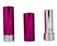 Three lipstick tubes with shiny metallic finishes, two in pink and one in silver, are standing upright against a white background.
