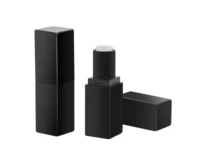 Two black rectangular non guided mini lipstick packaging tubes, one standing open with a white balm visible, the other closed and lying horizontally on a white background.
