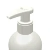 A close-up view of a white plastic dispensing pump named GSA with a metal-free pathway bottle against a plain white background.