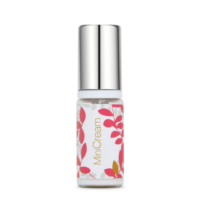A small mini packaging bottle labeled Mini Cream, features a silver cap and a charming design of red and pink leaves on its white background.