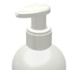 Close-up of the top portion of a white plastic dispensing pump with metal-free pathway labeled GSA bottle, commonly used for liquid soap or lotion, on a plain white background.