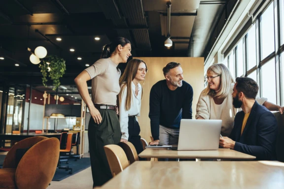 A group of employees collaborating around a table