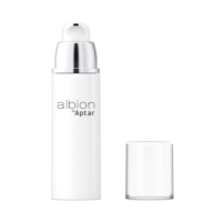 A white cosmetic pump bottle labeled "Albion by Aptar" stands upright on a plain white background. The bottle features Aptar’s airless beauty packaging, designed to protect sensitive formulations. Its clear cap is removed and placed beside it.