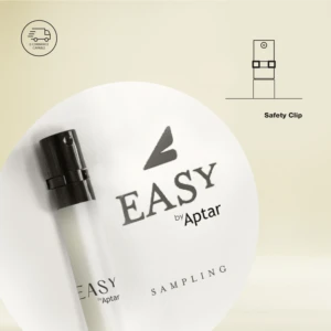 A close-up of a small spray bottle labeled EASY by Aptar SAMPLING with a black cap. An illustration in the upper right corner highlights the safety clip, showcasing innovative omnichannel packaging. Light beige background.
