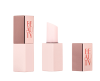 A pink and rose gold guided mini lipstick packaging labeled BEAUTY in red letters, shown with the cap on, cap off to reveal the pale pink lipstick, and the cap placed separately.