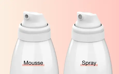 Close up of Aptar Beauty Meridian Aerosol Spray and Mousse Actuators with White Finish on Gradient Pink Background