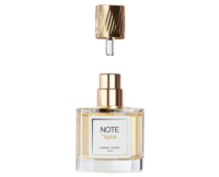 A clear glass perfume bottle with gold accents and a label reading NOTE by Aptar stands upright. Above it, a gold textured cap is shown lifted off, revealing the short tip of fragrance applicator.