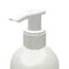 Close-up of a white plastic dispensing pump with metal-free pathway named GSA on a  bottle, commonly used for soap or lotion, against a plain white background.