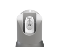 Close-up view of Sirena , an Aerosol Actuator with Bold Design with a wide ergonomic surface and integrated finger recess, against a plain white background.