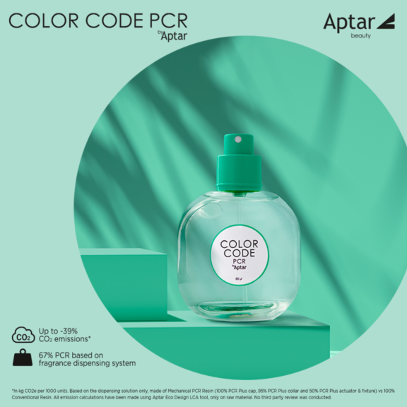 A clear bottle labeled COLOR CODE PCR by Aptar sits on a teal surface with geometric shapes and shadows. Text highlights reduced CO2 emissions and 67% PCR fragrance pump use in dispensing. The Aptar logo appears in the top right.