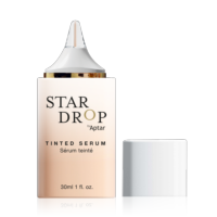 A bottle labeled STAR DROP by Aptar, featuring drop-by-drop dispensing, sits next to a removed white cap on a plain light background. The bottle contains 30ml (1 fl. oz.).