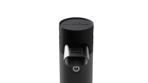 Top view of black cylindrical Kolibri soft mist inhaler (SMI) showing oval inhalation mouthpiece for lung delivery.