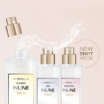 Three INUNE fragrance pumps on a pink gradient background