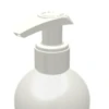 A close-up of the Dispensing Pump with Metal-Free Pathway named GSA on a white plastic bottle, commonly used for liquid soap or lotion, against a plain white background.