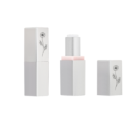 Two silver non guided mini lipstick packaging with black floral patterns are shown on a white background. One is closed, and the other is open with its cap beside it, showing the lipstick inside.