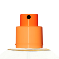 Close-up of an orange plastic fragrance pump named Color Code against a white background, highlighting the top part and spray mechanism.