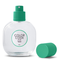 A clear plastic spray bottle labeled COLOR CODE PCR Aptar 80 ml features a green PCR fragrance pump nozzle and a matching green cap placed beside it, all set on a white background.