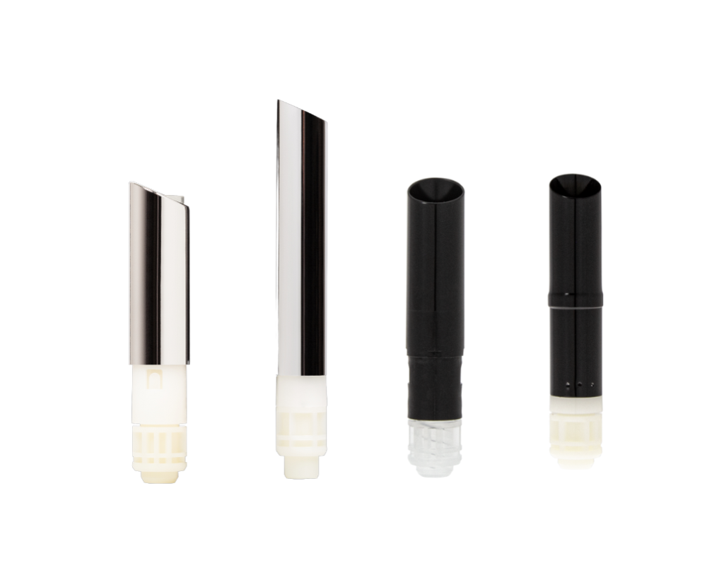 Four cylindrical lipstick cartridges stand upright in a row on a white background, featuring varying colors and designs including two with a guided lipstick mechanism and metallic tops, and two solid black with different tip styles.