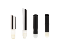 Four cylindrical lipstick cartridges stand upright in a row on a white background, featuring varying colors and designs including two with a guided lipstick mechanism and metallic tops, and two solid black with different tip styles.
