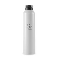 A tall, cylindrical white bottle with a black cap and an  ergonomic aerosol actuator, featuring the text S7 Aptar printed vertically on the front. The design is minimal and modern.