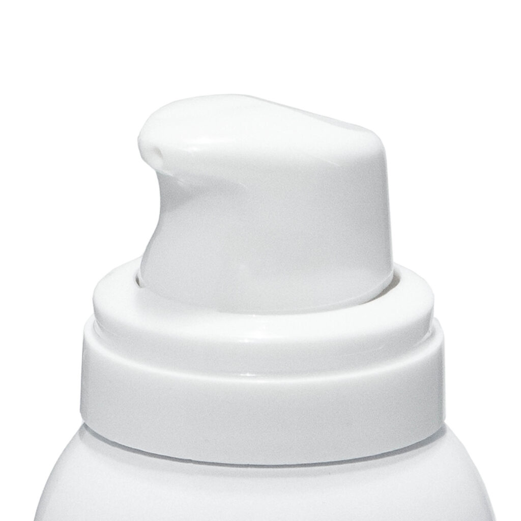 Close-up of Wren ,a white plastic aerosol actuator for mousse and lotion. The actuator is mounted on a white bottle against a plain white background.