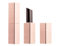 Three pink rectangular guided lipstick packaging cases with small white heart patterns
