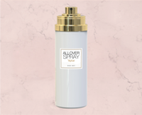 A white bottle with premium aerosol packaging named All Over Spray, featuring a gold cap and a label reading ALLOVER SPRAY by Aptar, stands on a light pink marble background.