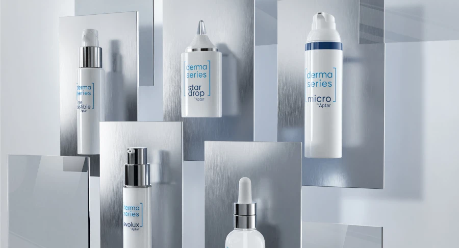 Five sleek white skincare product bottles labeled 