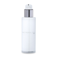 A white, cylindrical bottle with a versatile cosmetic pump and clear cap, labeled Metropolitan in subtle gray text, against a plain white background.