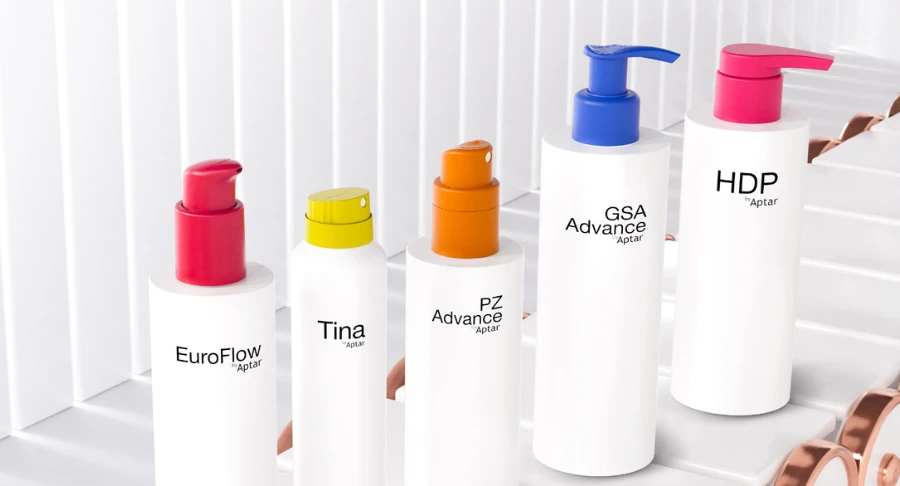 Five white packaging with surface effects colorful dispensing systems standing on a conveyor belt on a white background