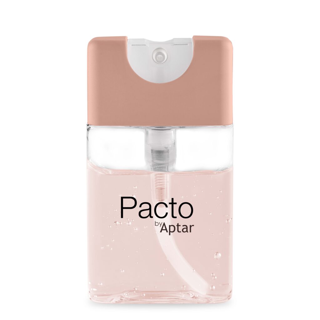 Close-up of an Aptar’s Purette Lotion bottle  with flat mini packaging , featuring a pale pink cap and a clear body filled with light pink liquid. The label reads 'Pacto by Aptar,' and small bubbles are visible inside the liquid.