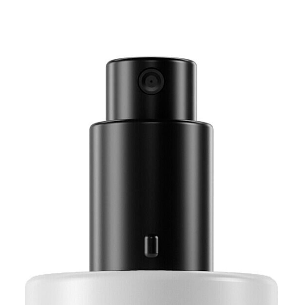 Close-up of a black customizable spray pump labeled PAV, mounted on a white bottle, featuring a fine mist nozzle, isolated against a plain white background.