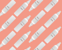 Multiple white EuroMist 2-Way spray pumps are arranged diagonally in a repeating pattern on a peach-colored background.